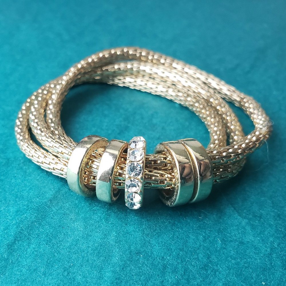 2/10$ Gold tone 3 strand bracelet
